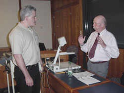 Speaker Neil Duane makes a point with member Scott Mountain.